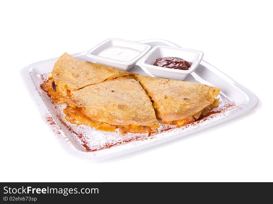 Quesadillas on whte plate with sauces