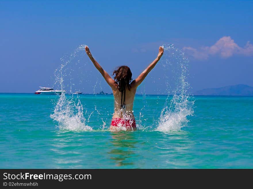 Girl with long hair playing in the sea. Girl with long hair playing in the sea