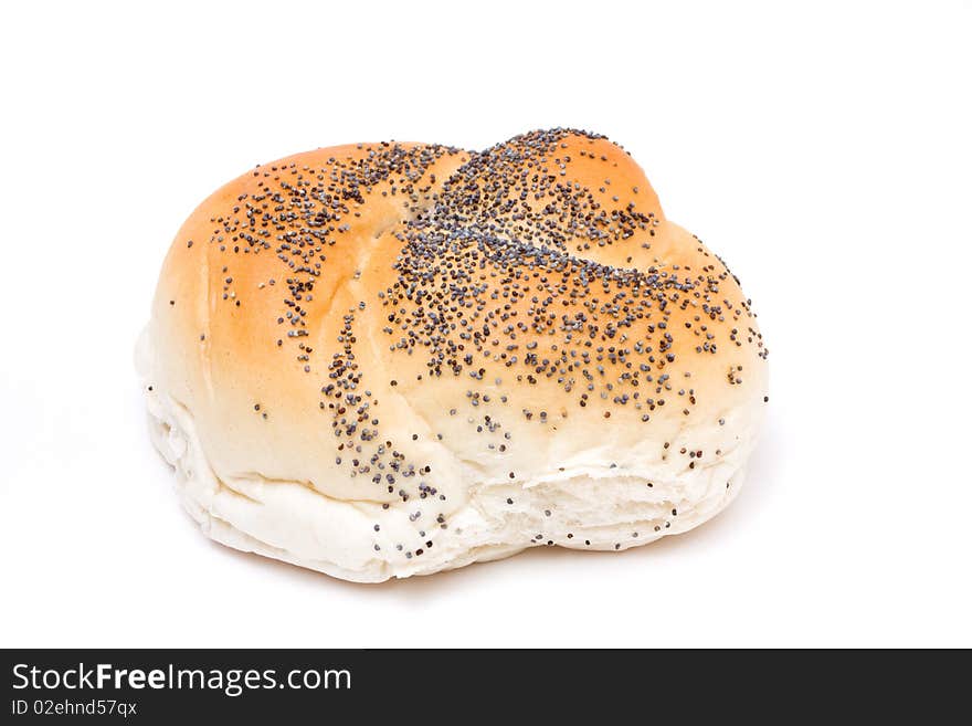 Seeded bread roll from low viewpoint isolated against white background.