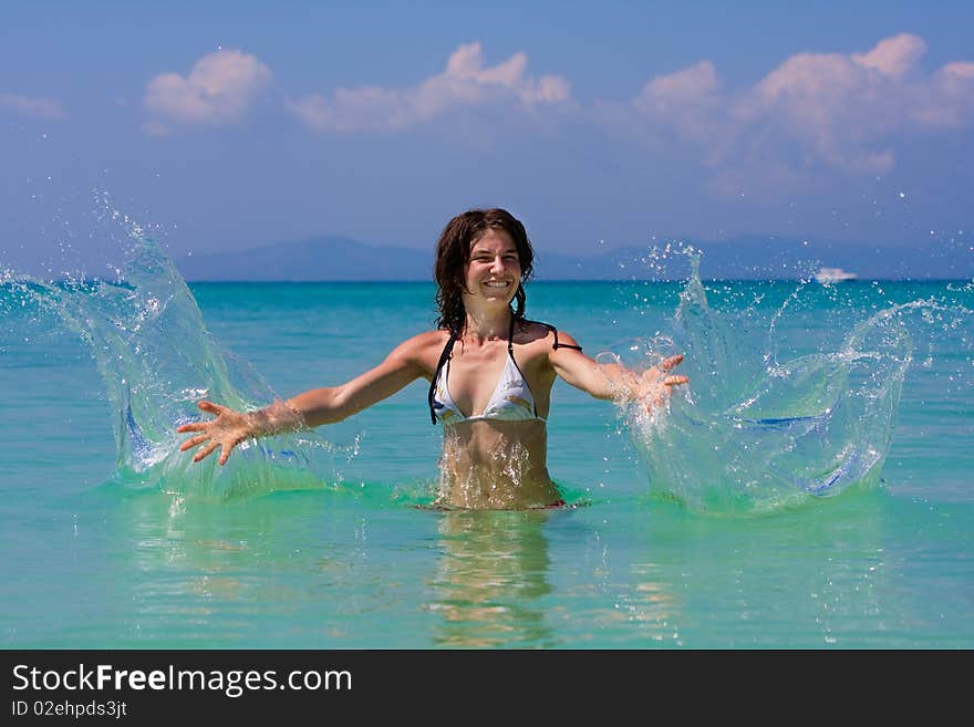 Girl with long hair playing in the sea. Girl with long hair playing in the sea