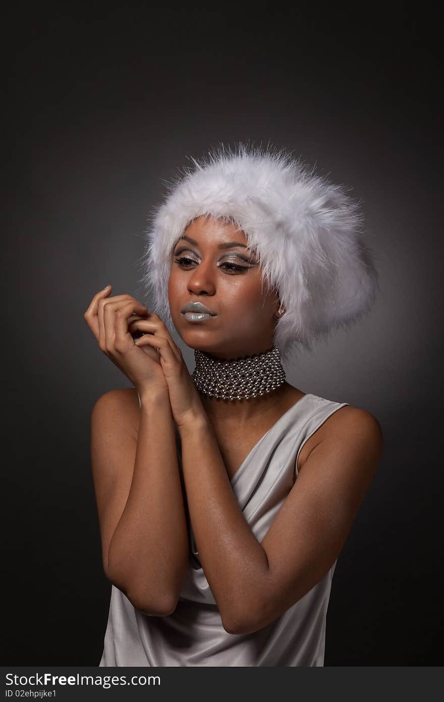 Afro-american woman portrait in big white hat