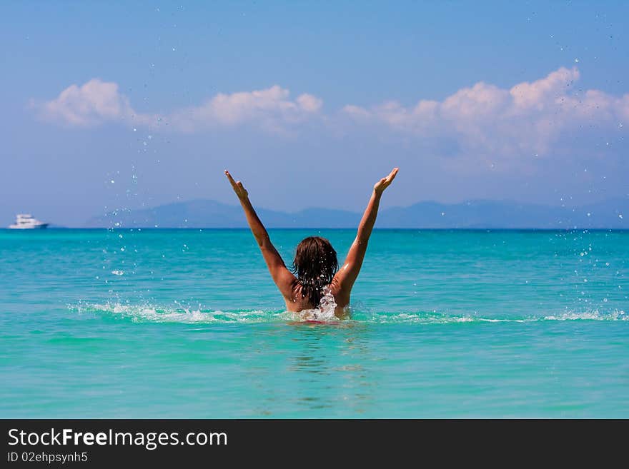 Girl with long hair playing in the sea. Girl with long hair playing in the sea