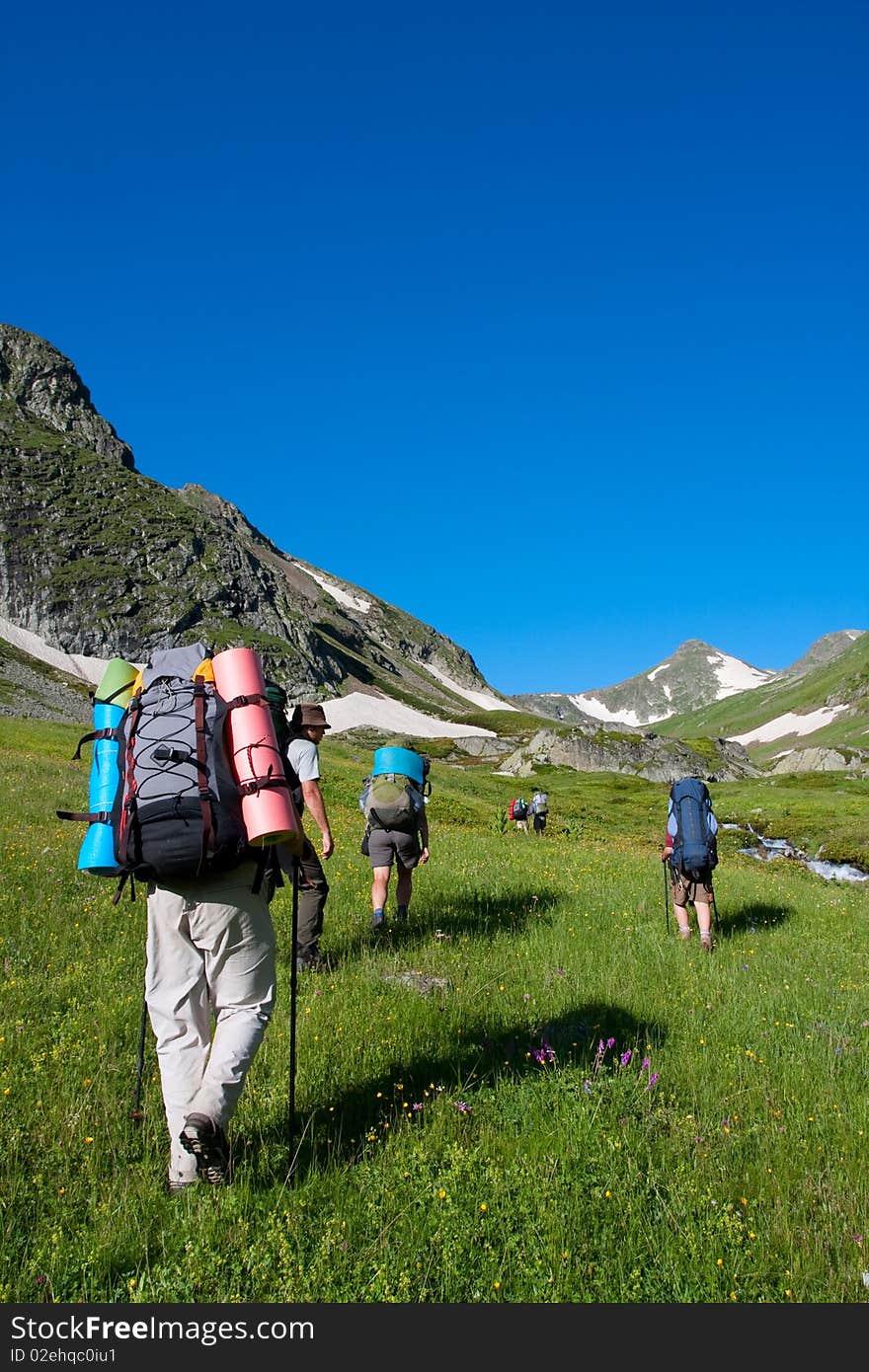 Happy hikers in Caucasus mountains