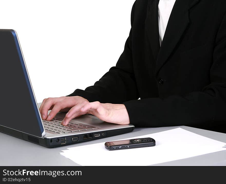 The successful young businessman using laptop