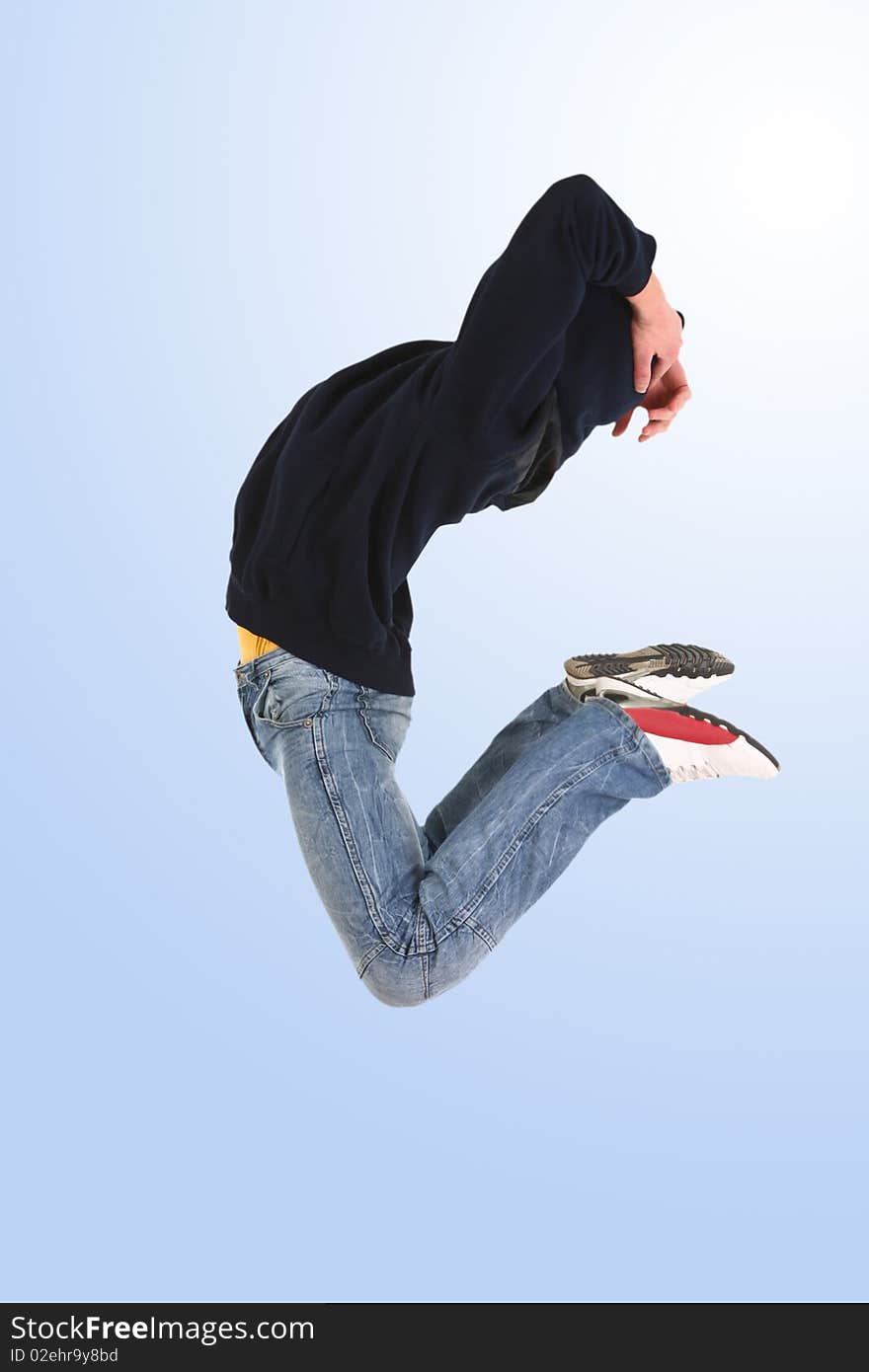 Jumping young dancer isolated on blue