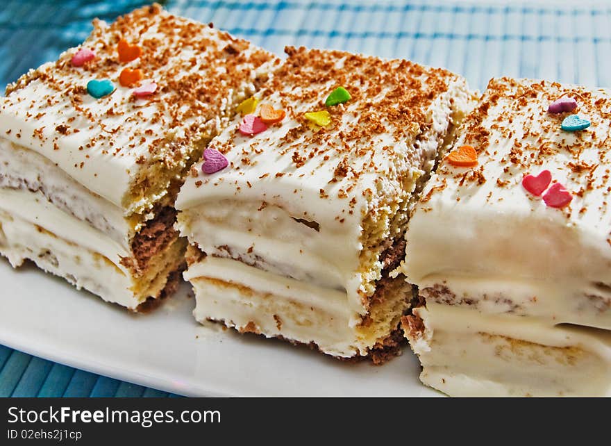 Slices of a cake decorated with hearts. Slices of a cake decorated with hearts.