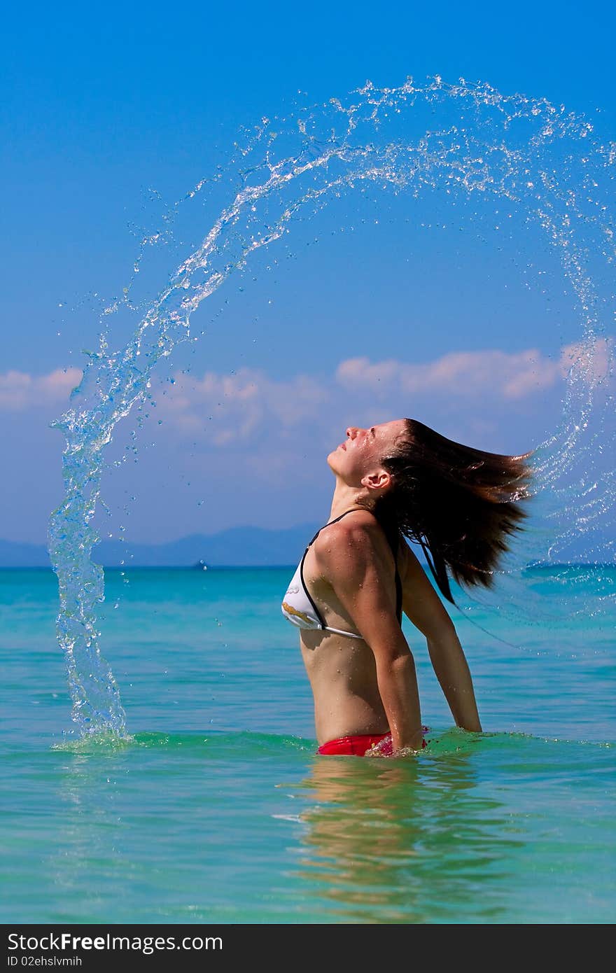 Girl with long hair playing in the sea. Girl with long hair playing in the sea