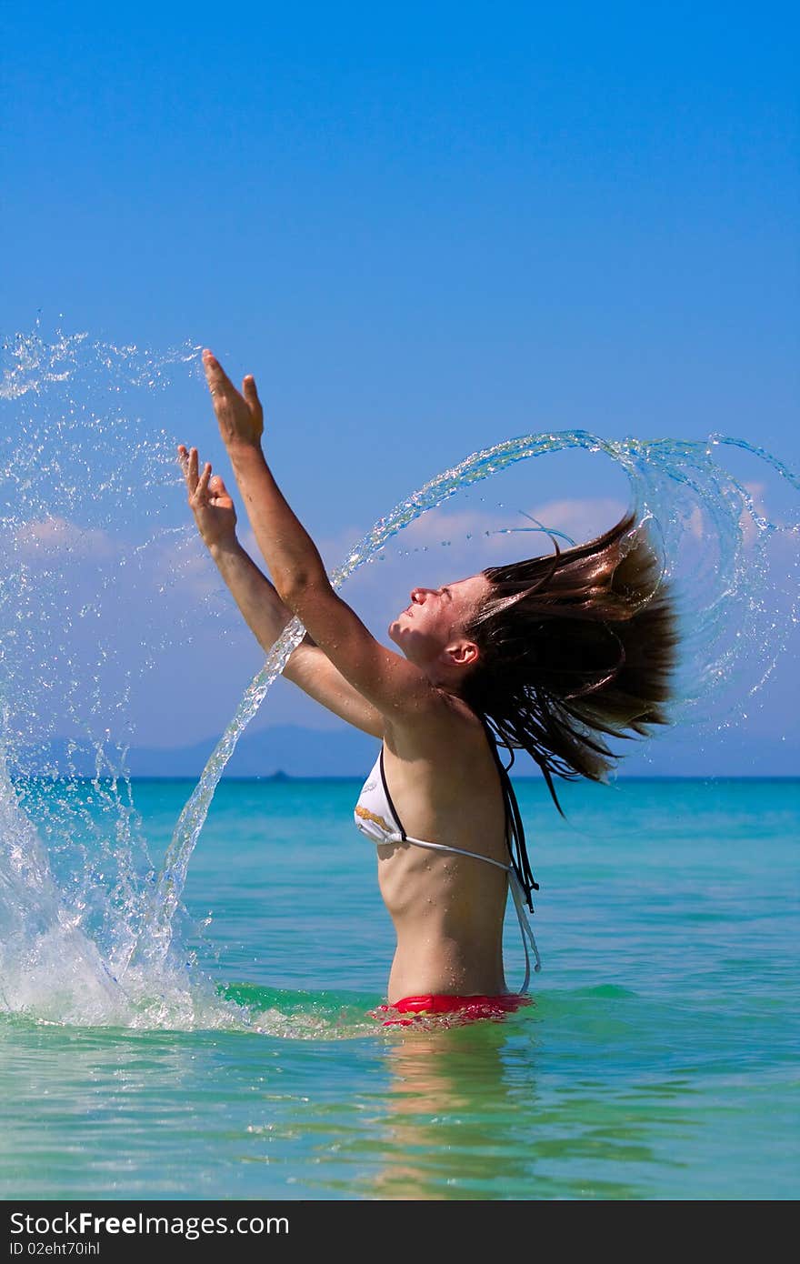 Girl with long hair playing in the sea. Girl with long hair playing in the sea