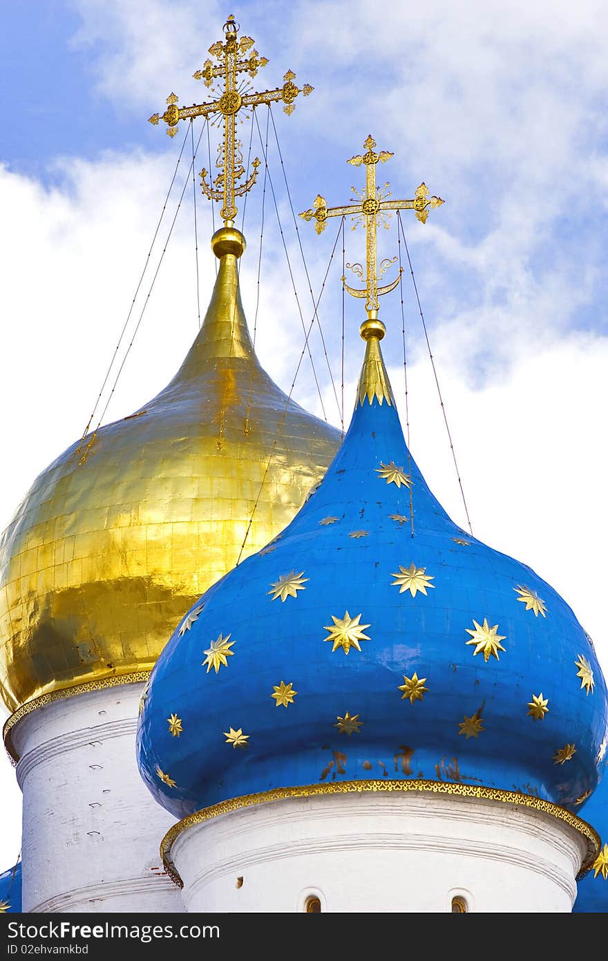 The golden and blue domes with crosses of the orthodox church. The golden and blue domes with crosses of the orthodox church