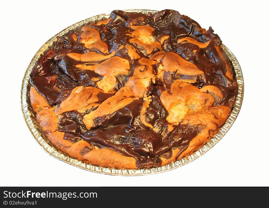 A whole chocolate cake, isolated against a white background.