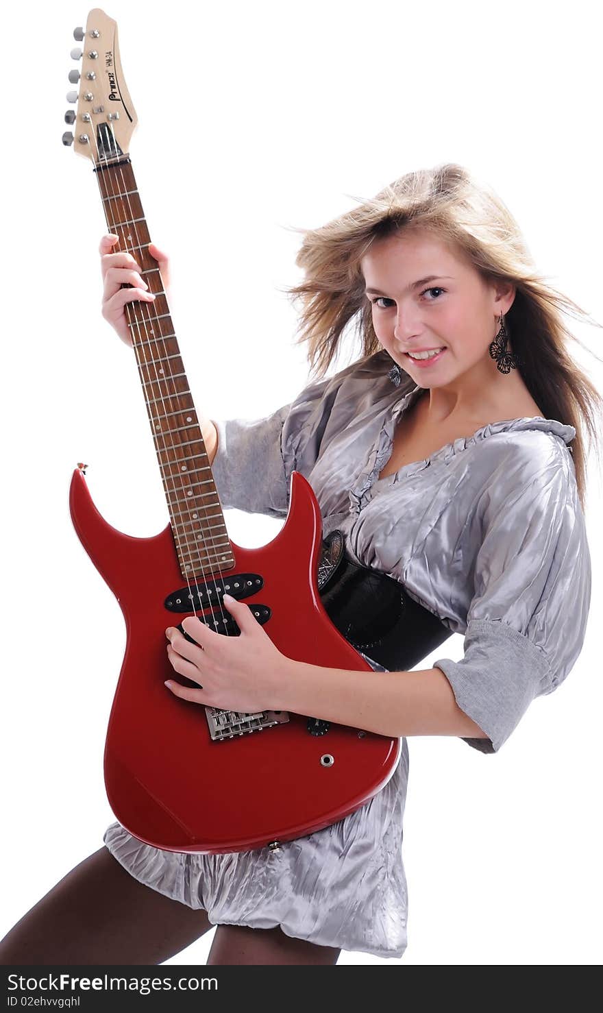 The young beautiful girl with a fair hair in a grey dress separately on a white background