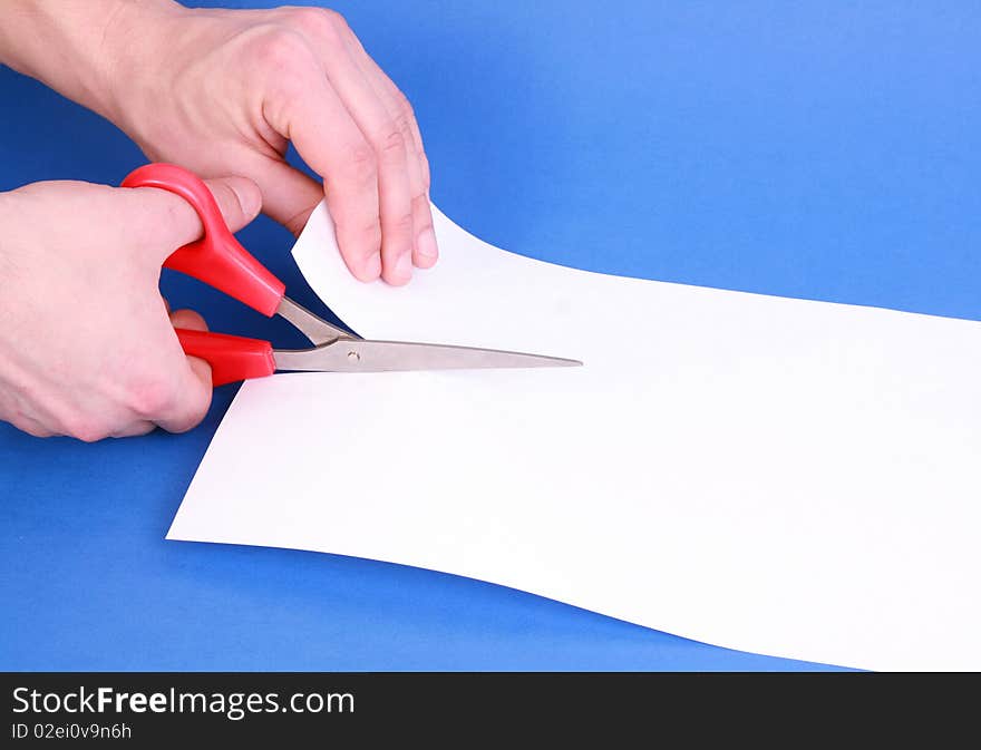 Cutting Paper with Scissors white