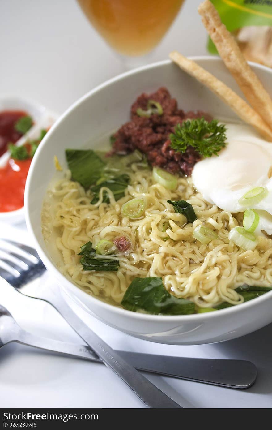 Mie serve in hot with egg and kornet