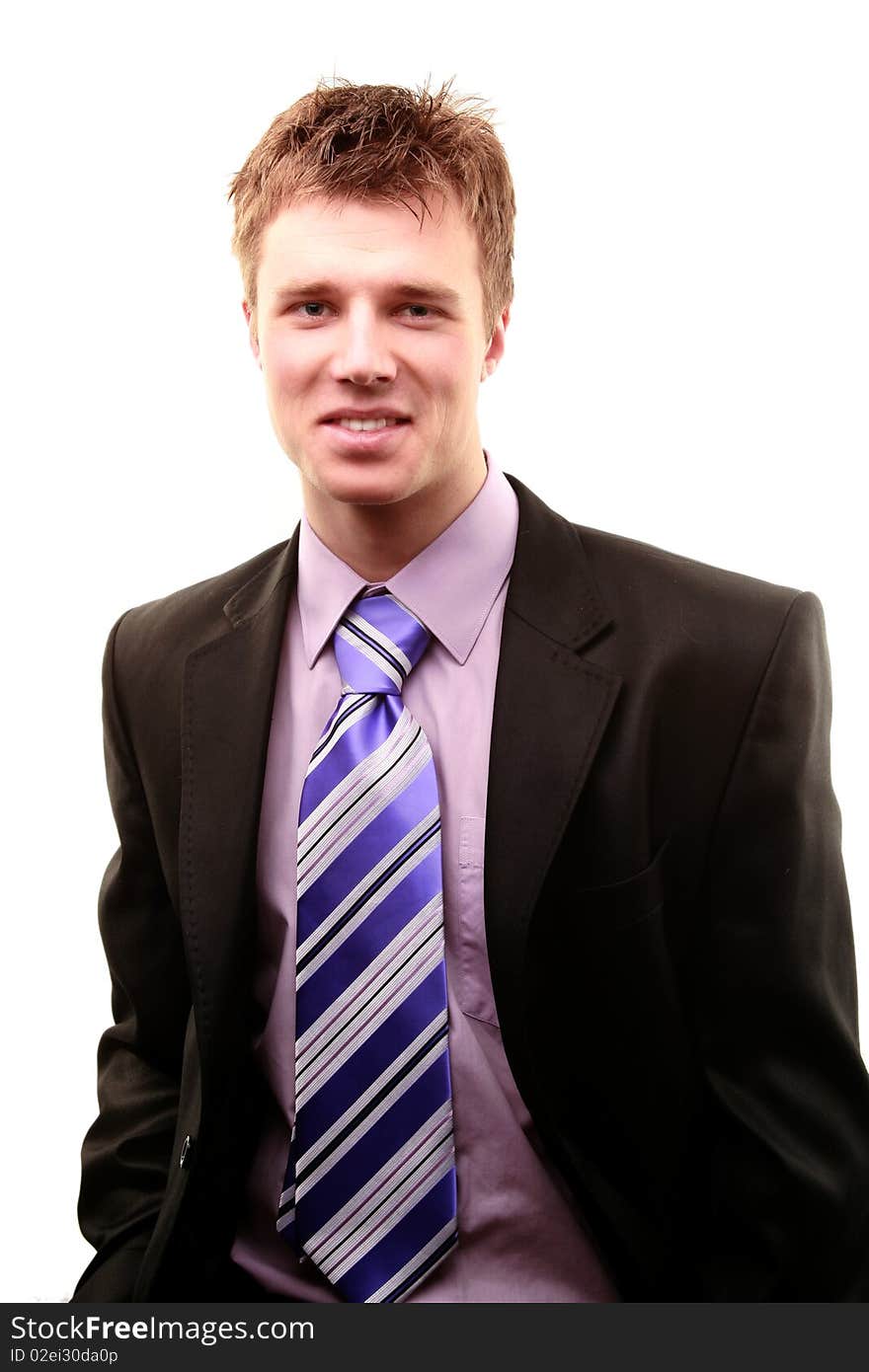 Smiling young businessman isolated on a white background