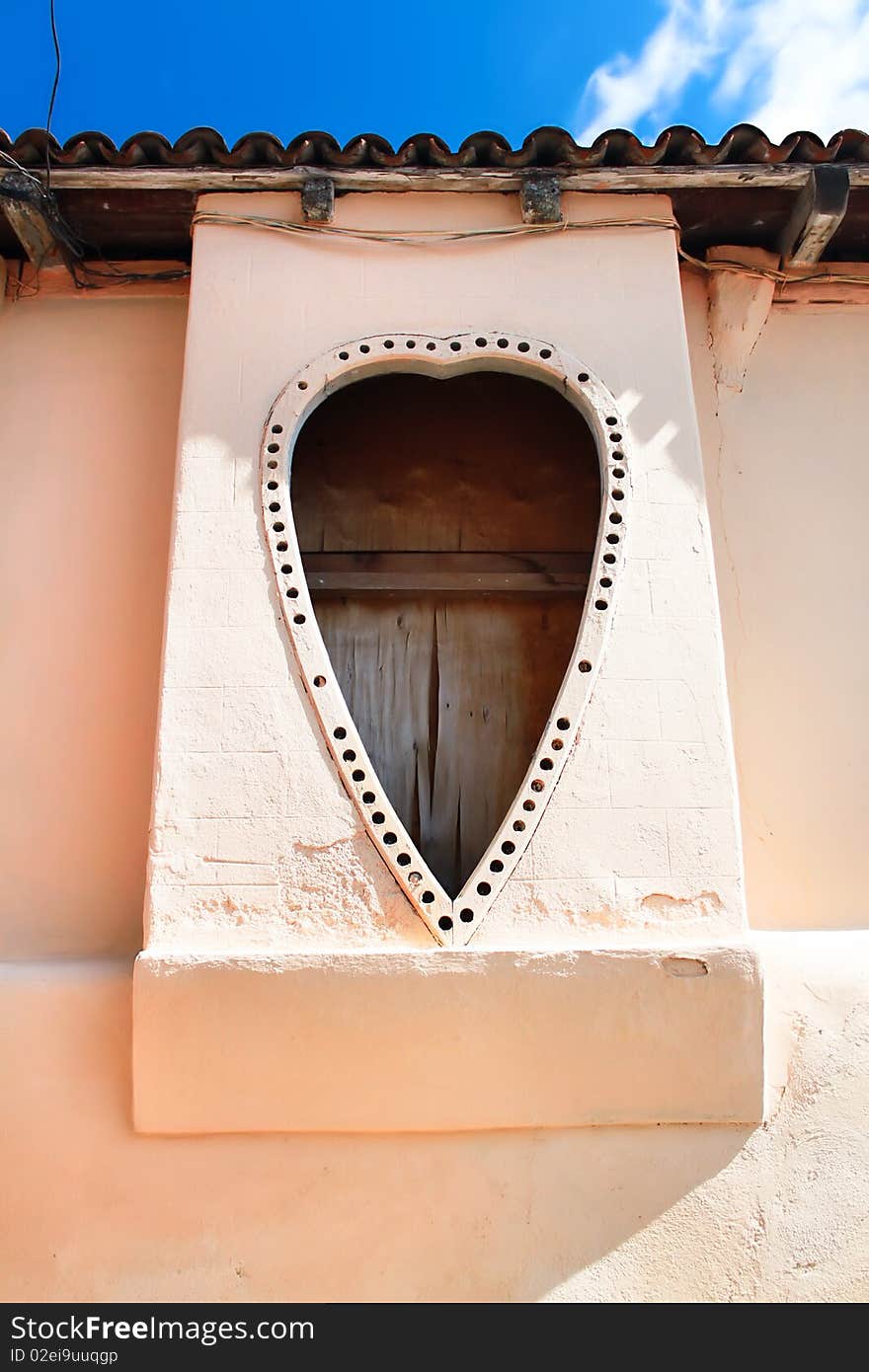 Heart shape windows. Detail of facade from vintage colonial building in Santiago de Cuba, Cuba