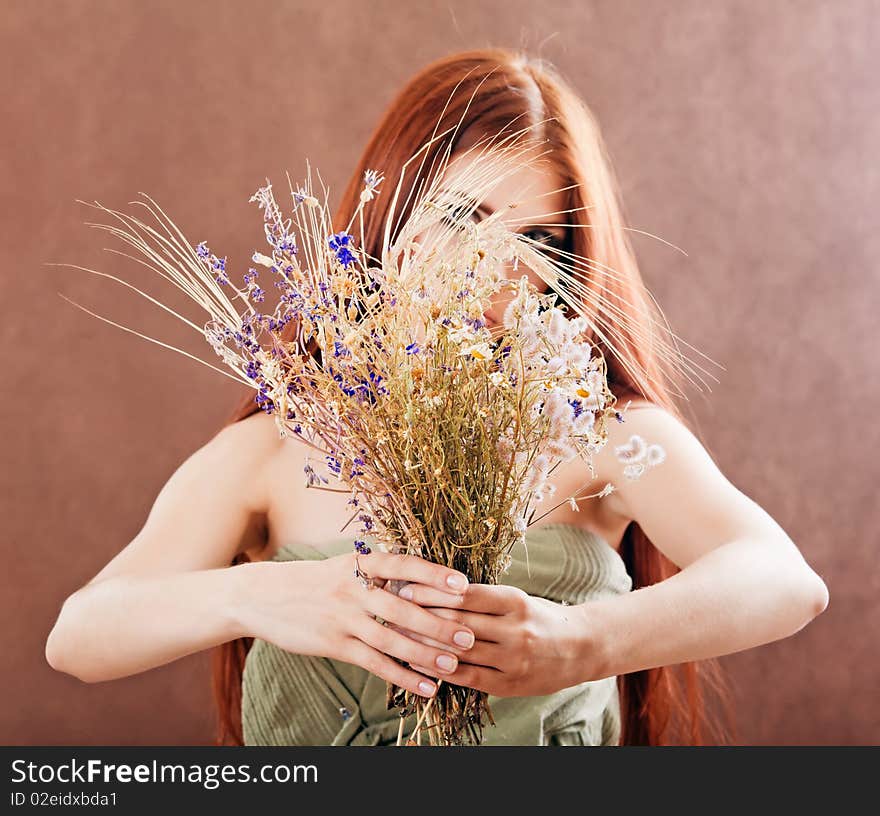 Girl holding flowers