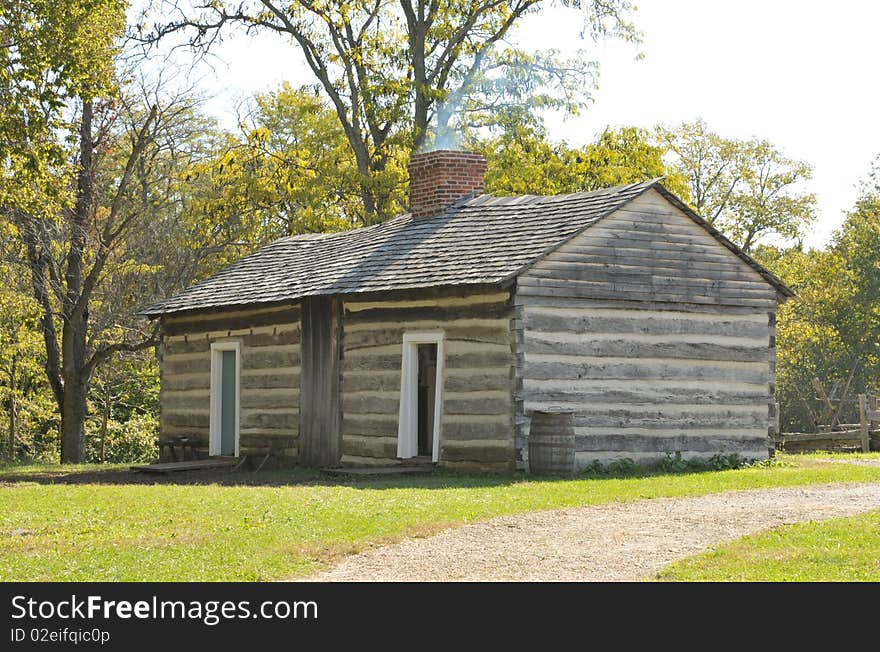 Replica of Thomas Lincoln's log cabin.  He was the father of President Abraham Lincoln.  In 1893, the original Thomas Lincoln log cabin was disassembled and shipped northward to serve as an exhibit at the World's Columbian Exposition in Chicago, Illinois. The original cabin was lost after the Exposition, and may have been used as firewood. However, the cabin had been photographed many times, and an exact replica was built from the photographs and from contemporary descriptions.  The reconstruction of the Thomas Lincoln log cabin was completed in 1934.