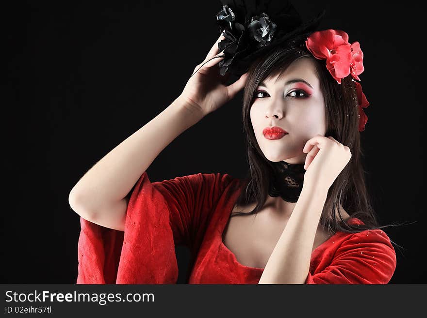 Portrait of a beautiful woman in medieval era dress. Shot in a studio. Portrait of a beautiful woman in medieval era dress. Shot in a studio.