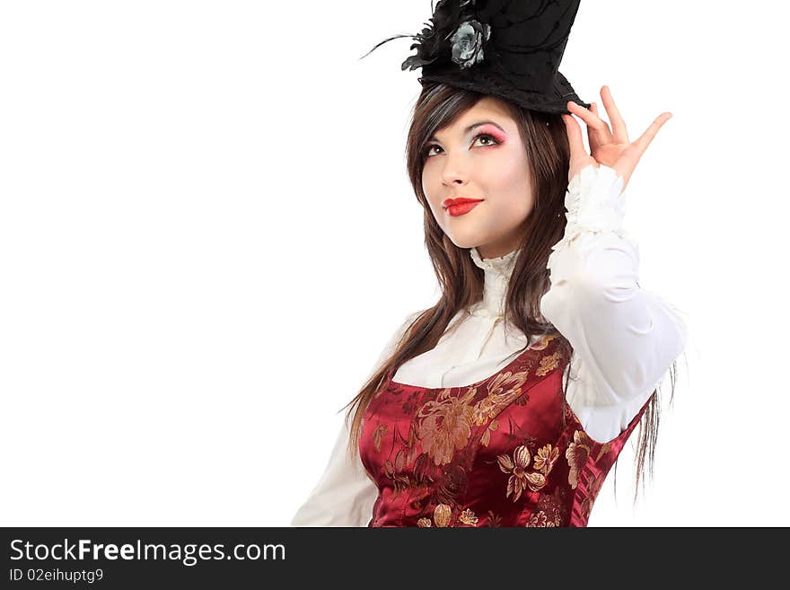 Portrait of the elegant young woman in 19th century costume holding walkingstick in her hands. Shot in a studio. Portrait of the elegant young woman in 19th century costume holding walkingstick in her hands. Shot in a studio.