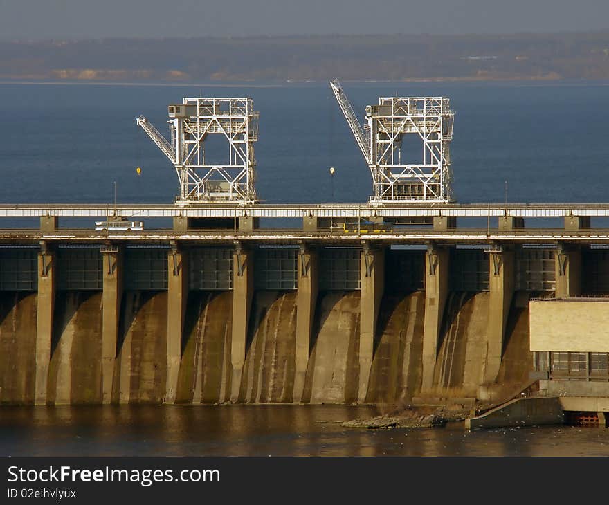 Overflow dam with two gantry crane standing above. Overflow dam with two gantry crane standing above