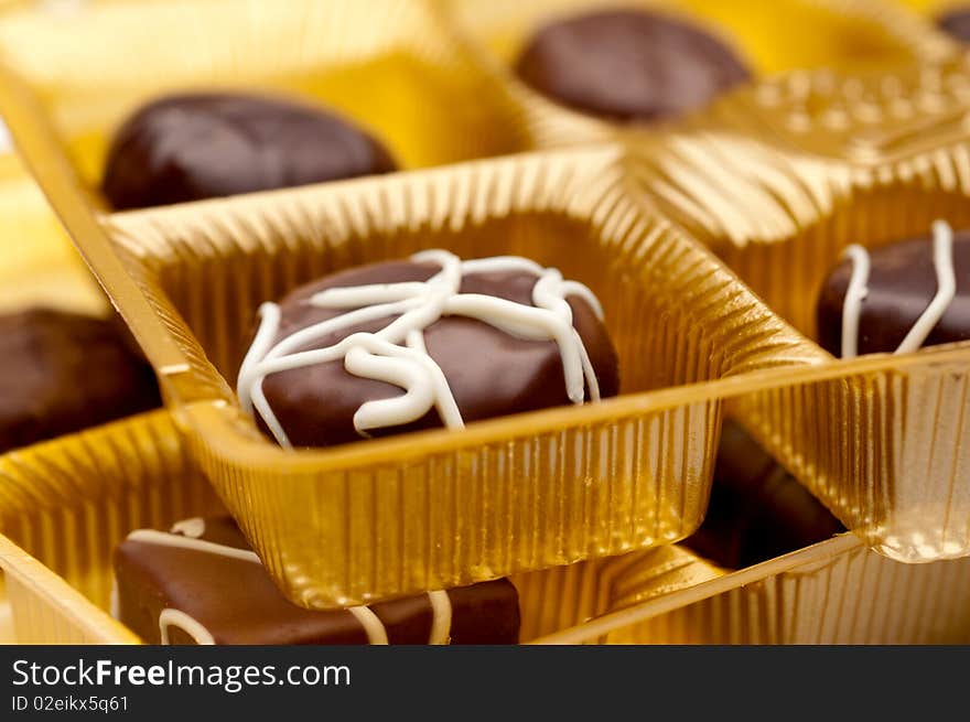 A horizontal image of two trays of chocolates