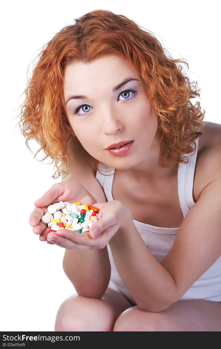 Woman with pill in studio