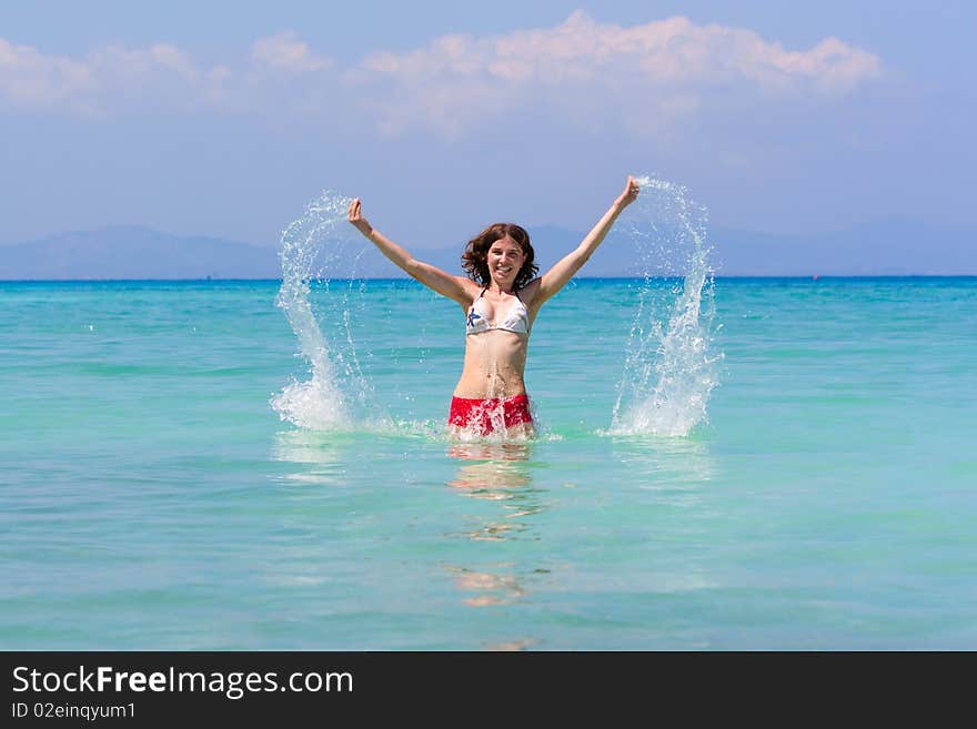 Girl with long hair playing in the sea. Girl with long hair playing in the sea