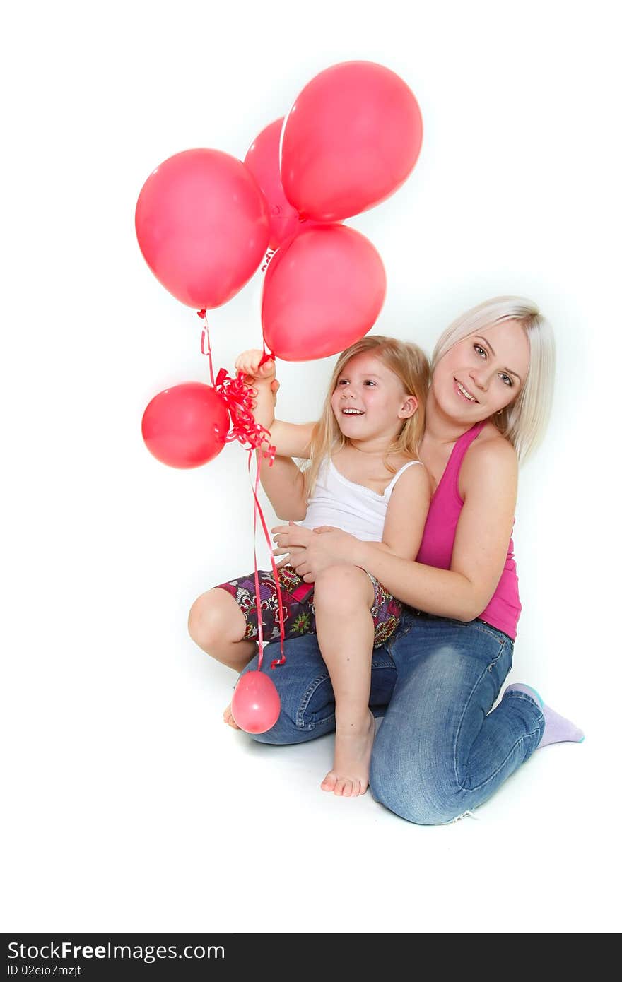 Happy mother and daughter with red balloons