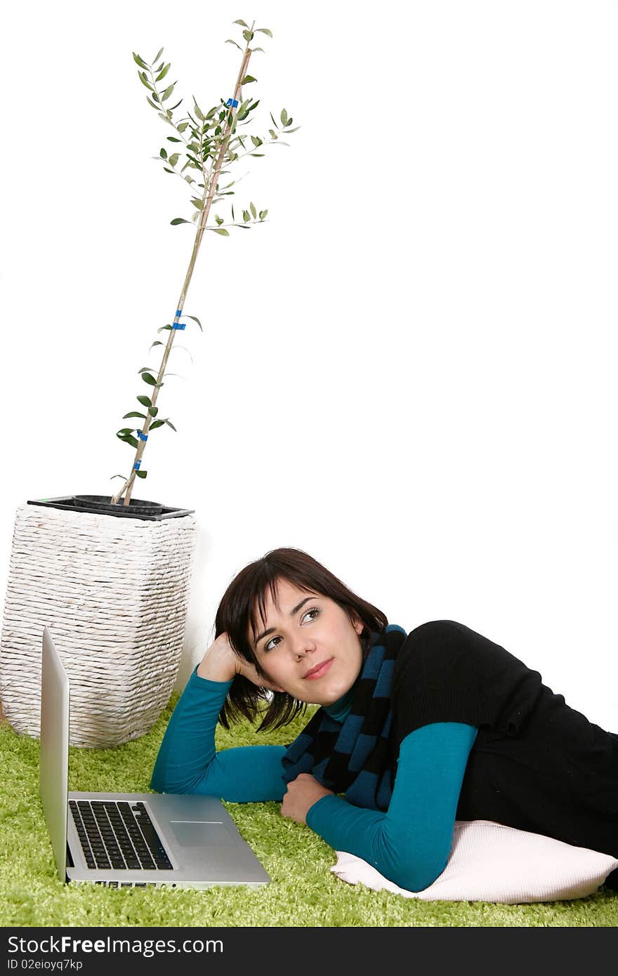 Woman with laptop dreaming about the future with olive tree in background. Woman with laptop dreaming about the future with olive tree in background