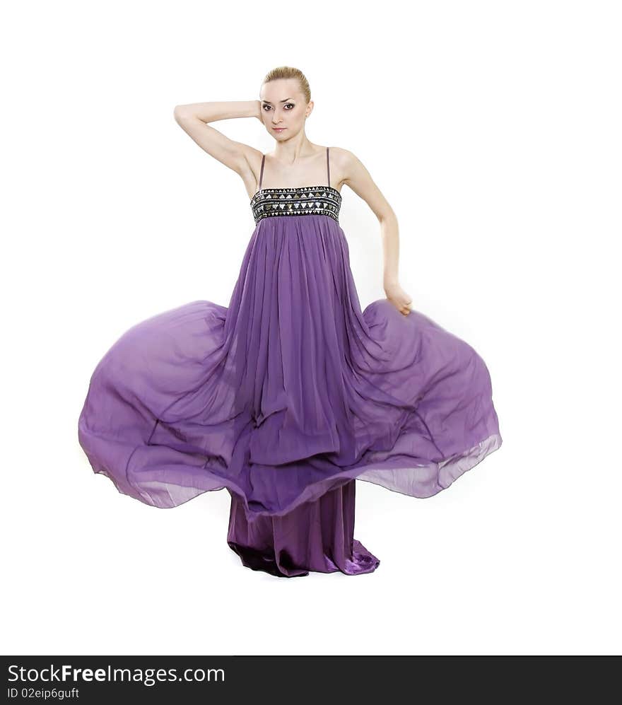 Young beautiful woman in long purple dress