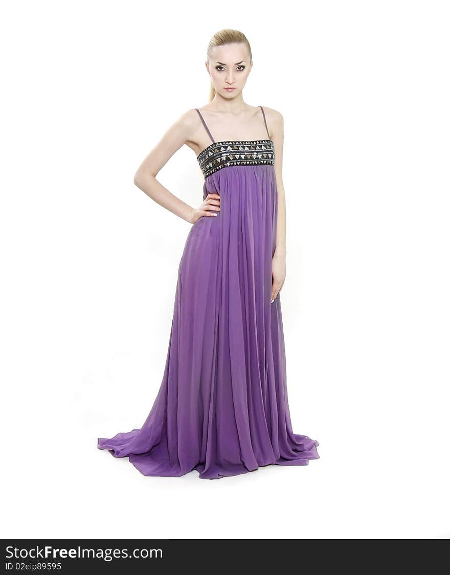 Young beautiful woman in long purple dress