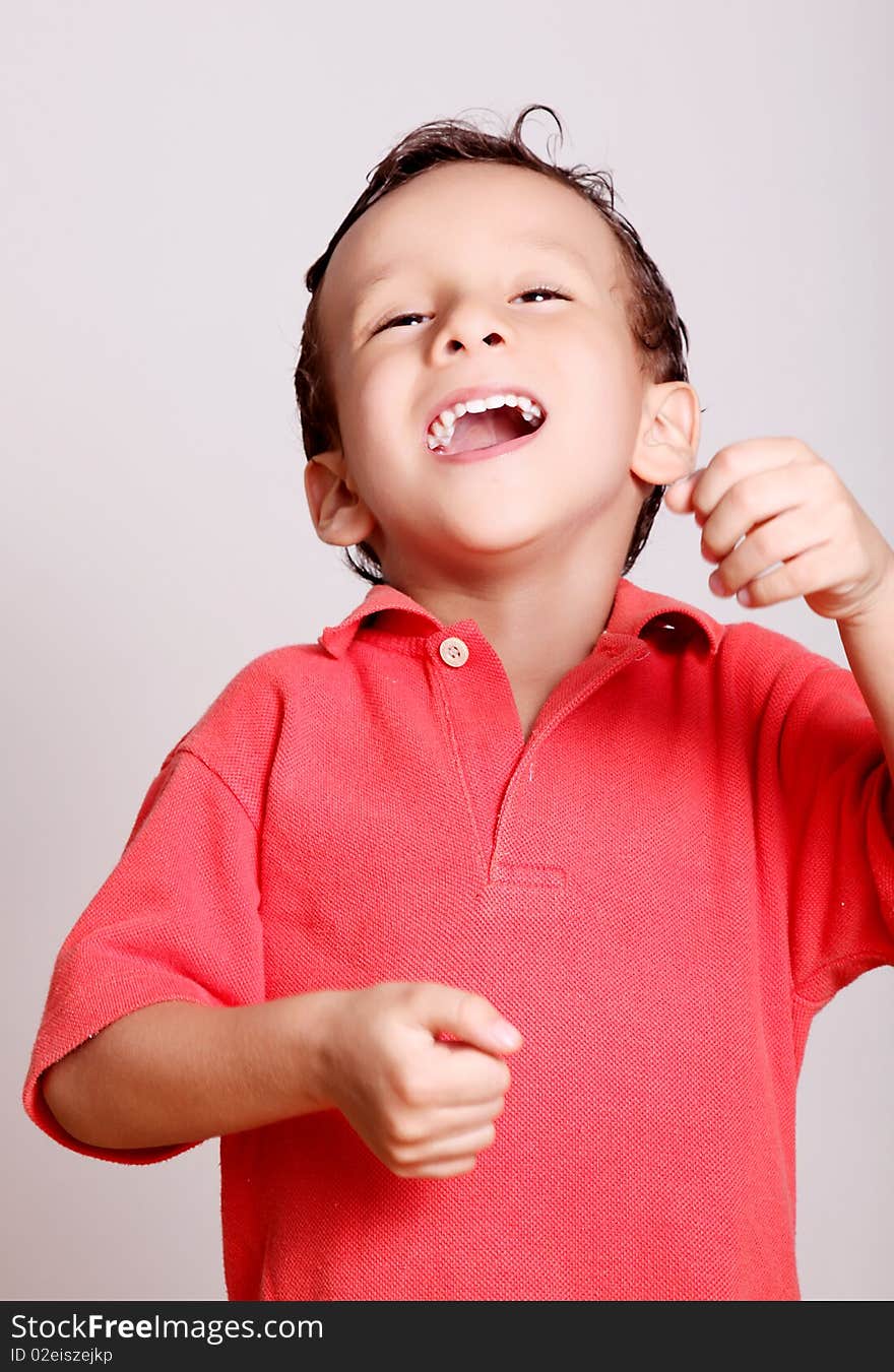 Happy child over white background. Smiling and looking at camera. Happy child over white background. Smiling and looking at camera