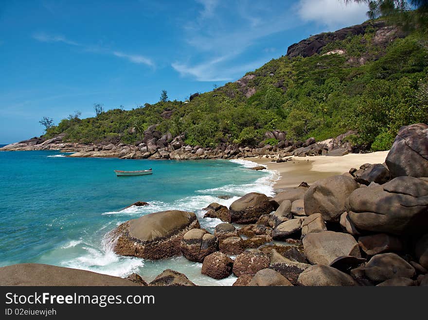 Seychelles stones and palm trees on the bank of azure ocean. Seychelles stones and palm trees on the bank of azure ocean