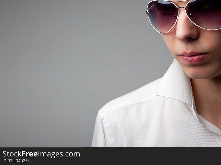 Portrait of young handsome man in sunglasses