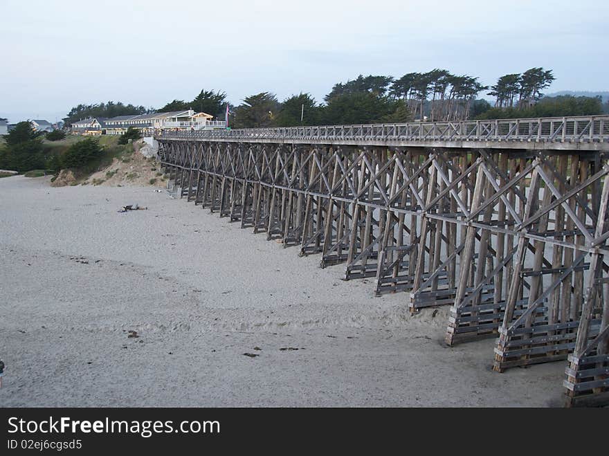 Wooden Bridge Over Beach