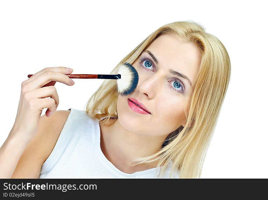 Beautiful girl with cosmetics brush on white. Beautiful girl with cosmetics brush on white