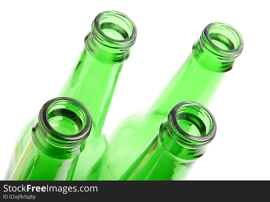 Green glass empty bottle on white background