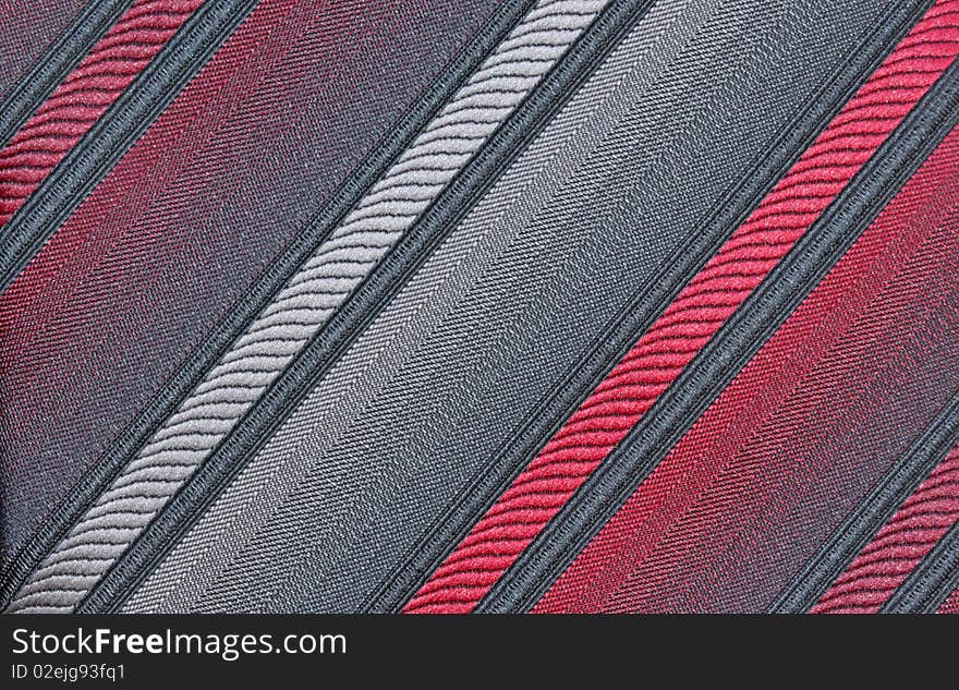 Red, gray and black diagonal patterned fabric for background. Red, gray and black diagonal patterned fabric for background