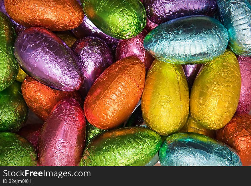 Variety chocolate easter eggs wrapped in colorful shiny foil. Variety chocolate easter eggs wrapped in colorful shiny foil