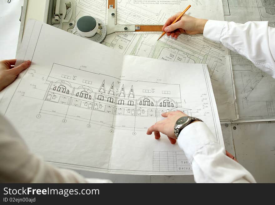 An image of two architects working at the project