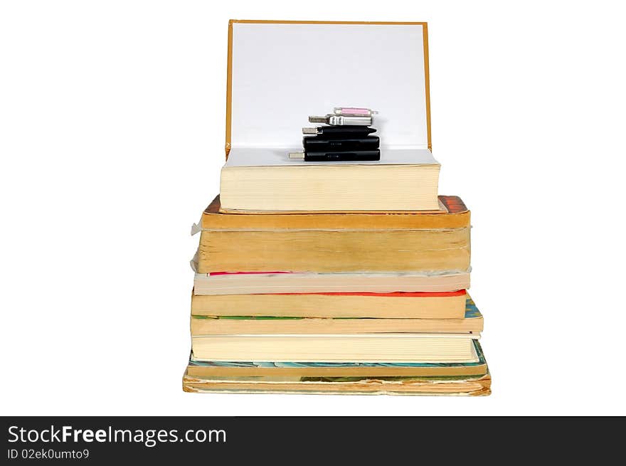 Stack of books and memory on the top, isolated on white