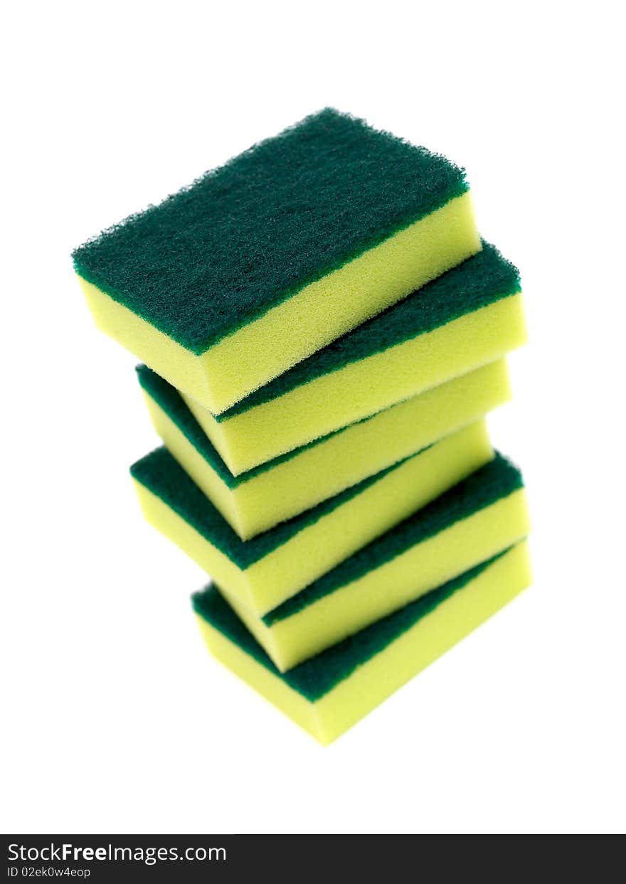 Household scourers stacked and isolated against a white background