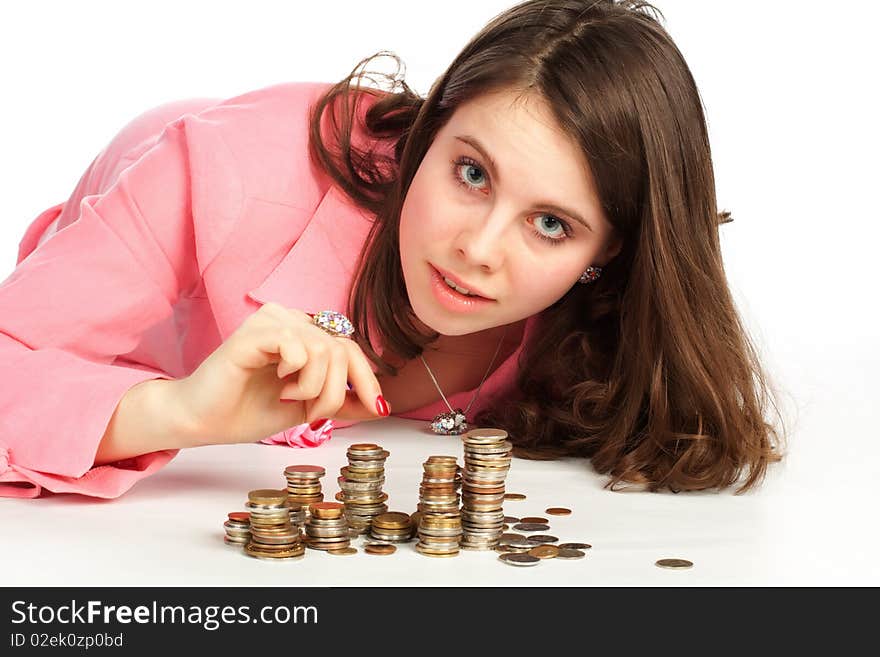 Woman touching stacks of coins