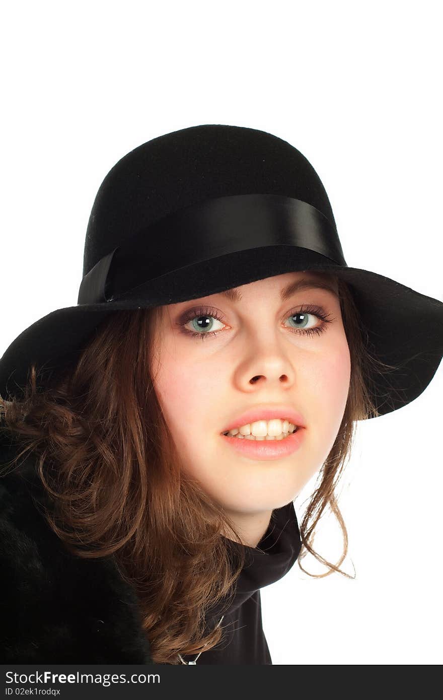 Beautiful young smiling woman with black hat