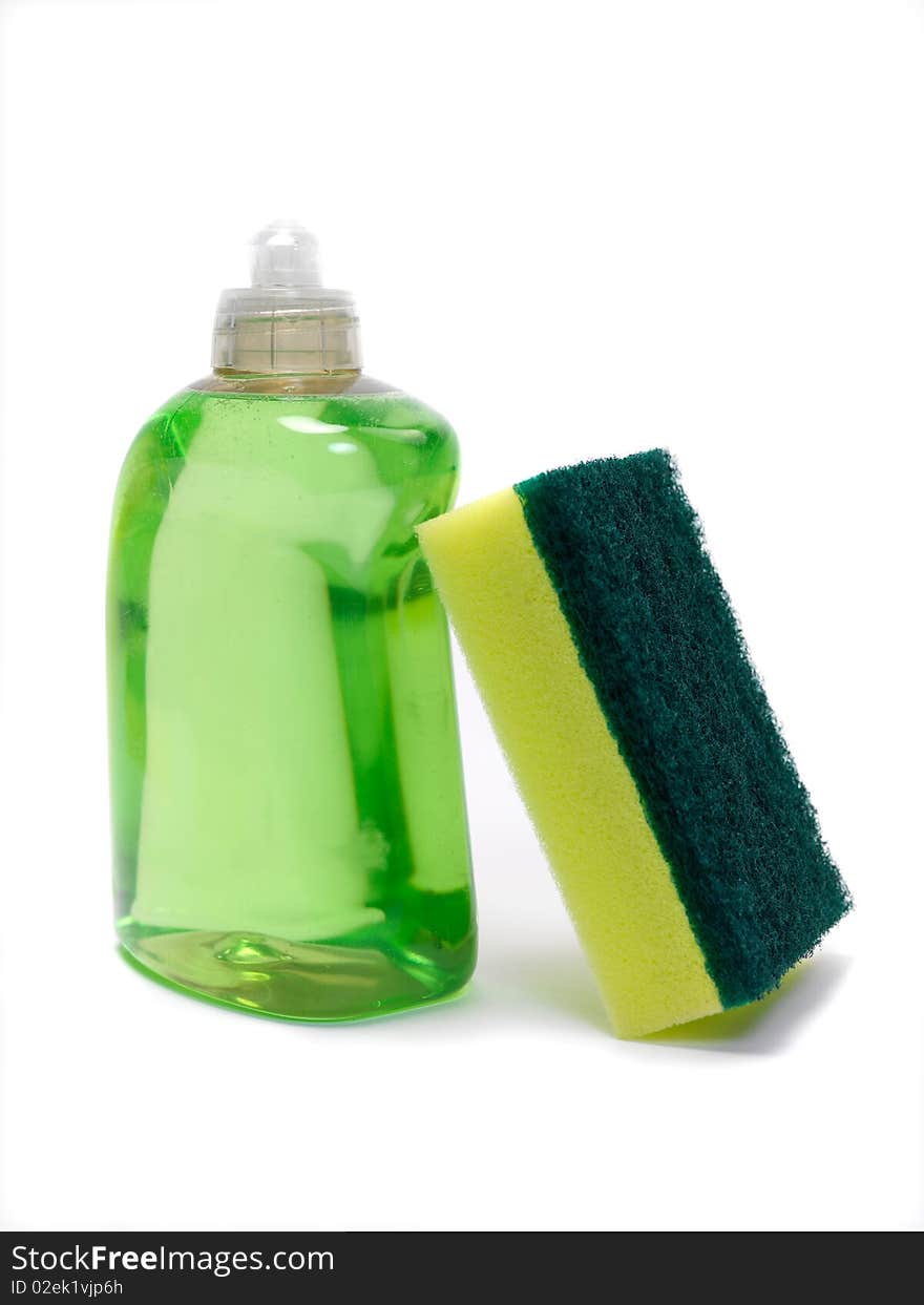 Household scourers stacked against dishwashing detergent and isolated against a white background. Household scourers stacked against dishwashing detergent and isolated against a white background