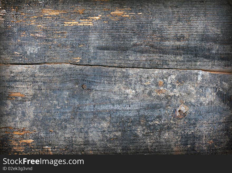 Grunge wooden background. Very old and worn wooden plank