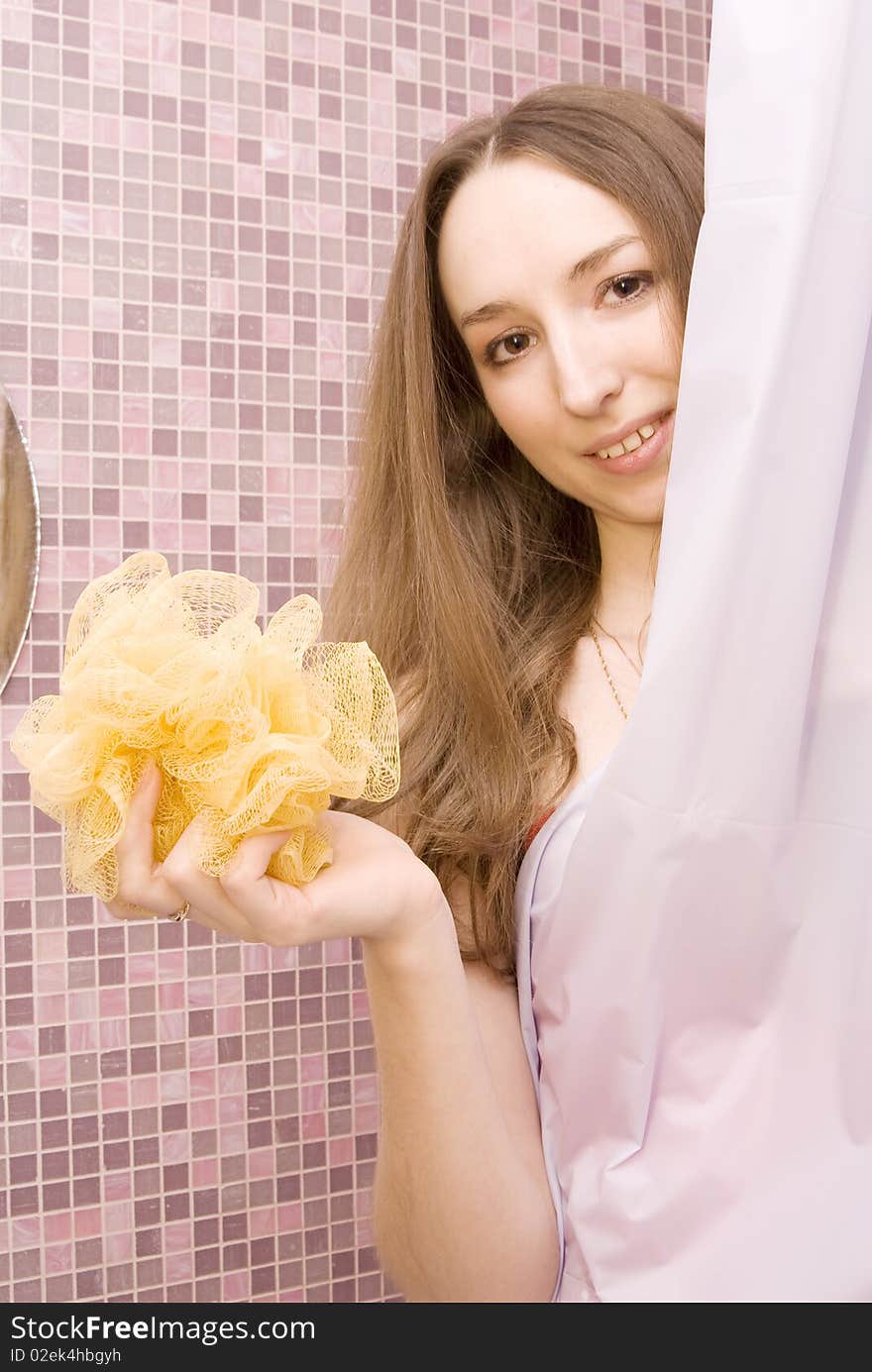 Girl has hidden behind a curtain in a shower. Girl has hidden behind a curtain in a shower