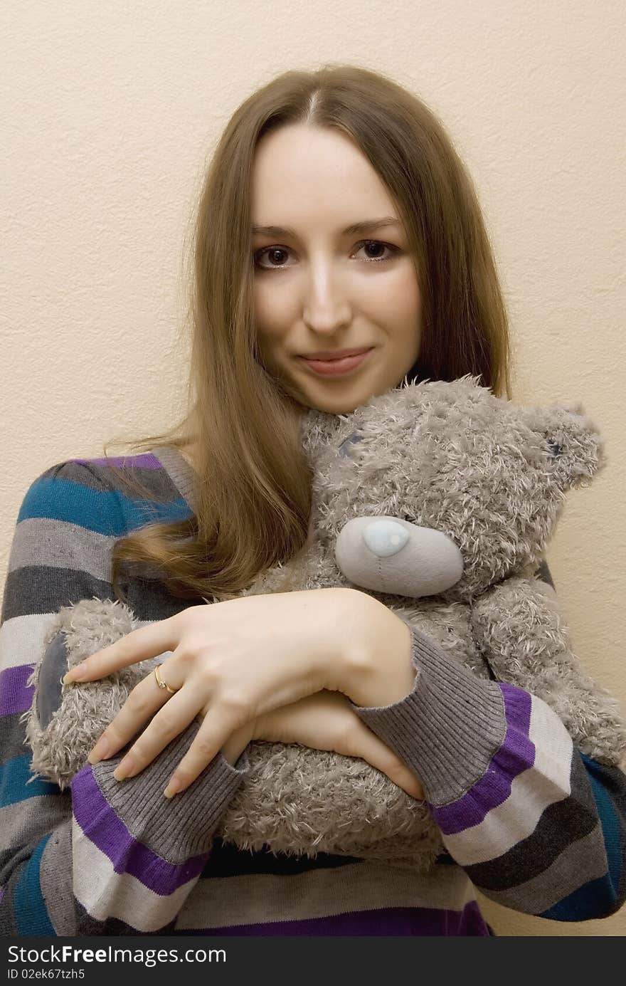 Girl embraces a bear