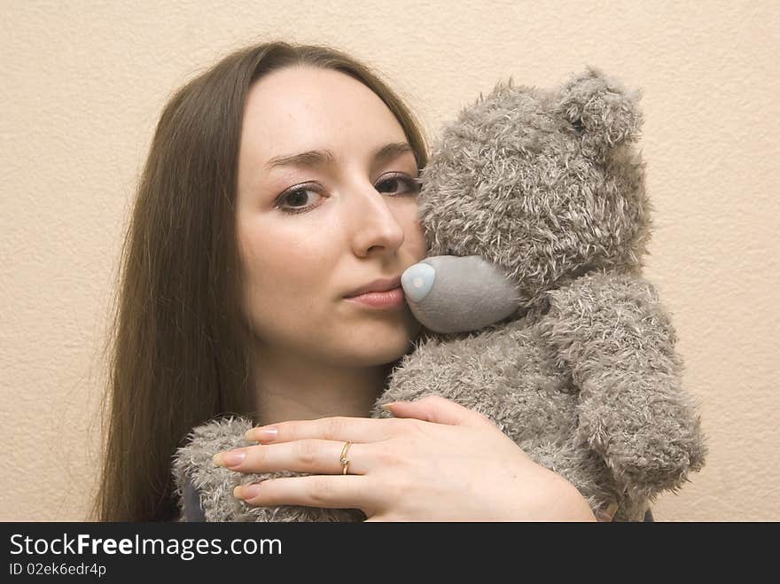 Girl Embraces A Bear