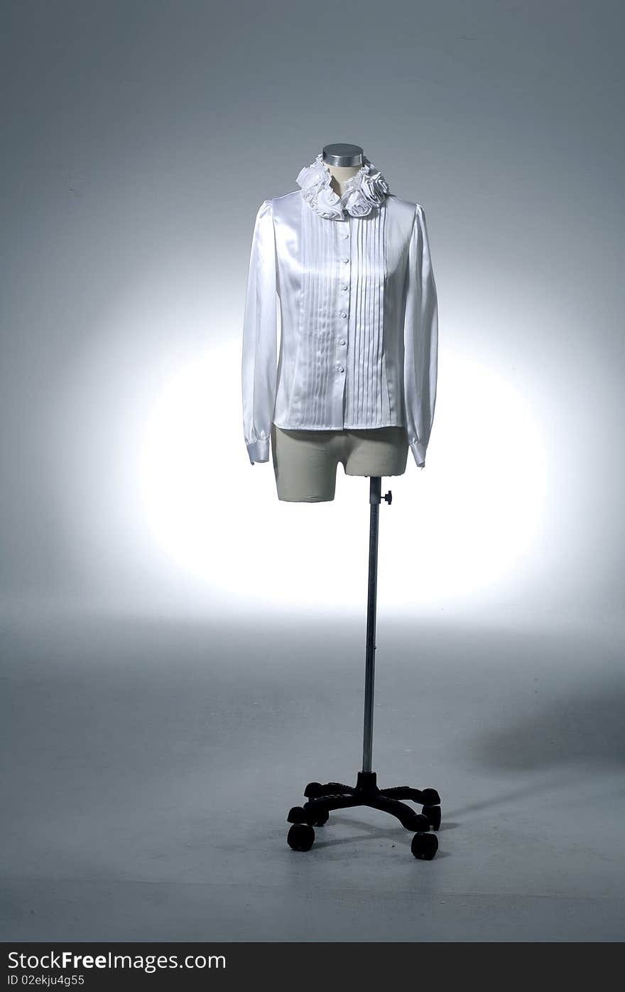 Woman shirt on mannequin on light background